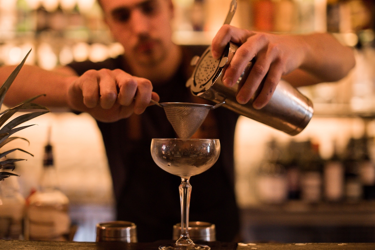Bartender preparing drinks at Sugar Run Kitchener cocktail bar