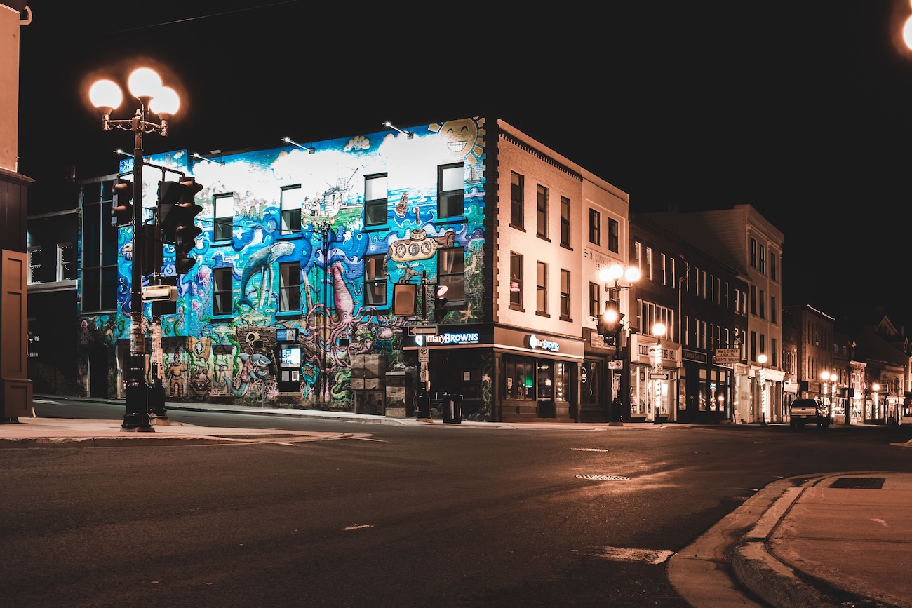 Colourful street murals in downtown Sudbury Ontario including the Alex Trebek mural